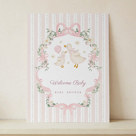 Unframed Welcome Baby poster in pink stripes and watercolour geese, standing on a cream shelf