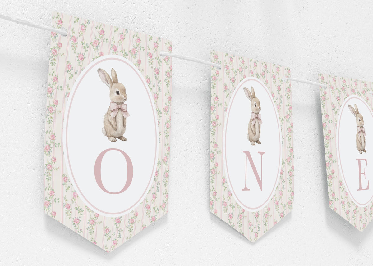 ONE high-chair banner, three floral pennants hanging on a white wall, close up