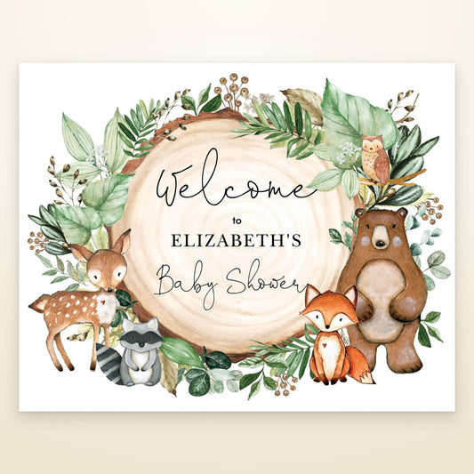 Woodland baby shower welcome sign with watercolour deer, fox, bear, raccoon and owl around a wood slice
