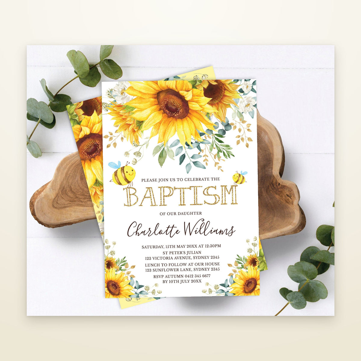 Bee and sunflower baptism invitation on a wood slice with eucalyptus, details filled in